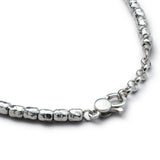 Detail of handmade 925 sterling silver nugget bracelet with organic irregular surface