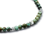 Detail of natural African Turquoise elastic bracelet with smooth 925 sterling silver pebble elements and BC centre cube