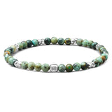 African Turquoise elastic bracelet with 925 sterling silver pebble elements and engraved BC centre cube