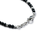 Detail of natural Black Onyx bracelet with diamond-cut 925 sterling silver cubes