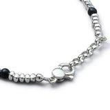 Detail of natural Black Onyx bracelet with smooth 925 sterling silver pebble elements