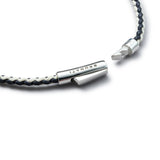 Detail of navy and off-white braided organic cotton bracelet with BRUNATI 925 Italian sterling silver clasp
