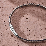 Navy and off-white braided organic cotton bracelet with 925 sterling silver clasp styled on the wrist