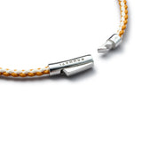 Detail of orange and off-white braided organic cotton bracelet with BRUNATI 925 Italian sterling silver clasp