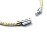 Detail of yellow and off-white braided organic cotton bracelet with BRUNATI 925 Italian sterling silver clasp