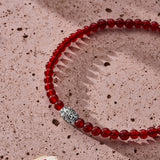 Natural Carnelian elastic bracelet with engraved sterling silver centre element styled in a Brunati Como setting