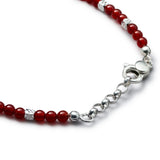 Detail of natural Carnelian bracelet with diamond-cut 925 sterling silver cubes