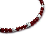 Detail of natural Carnelian elastic bracelet with organic 925 sterling silver nuggets and BC centre cube