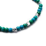 Detail of natural Chrysocolla elastic bracelet with smooth 925 sterling silver pebble elements and BC centre cube