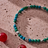 Chrysocolla elastic bracelet with sterling silver pebble elements styled in a Brunati Como setting