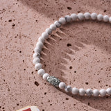 Natural Howlite elastic bracelet with engraved sterling silver centre element styled in a Brunati Como setting