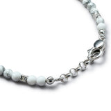Detail of natural Howlite bracelet with diamond-cut 925 sterling silver cubes