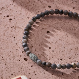 Natural Labradorite elastic bracelet with engraved sterling silver centre element styled in a Brunati Como setting