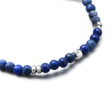 Detail of natural Lapis Lazuli elastic bracelet with smooth 925 sterling silver pebble elements and BC centre cube