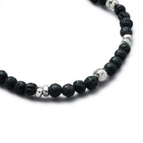 Detail of natural Lava Stone elastic bracelet with smooth 925 sterling silver pebble elements and BC centre cube