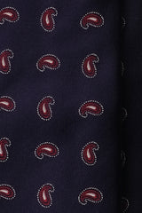 Close-up of woven paisley pattern on navy silk jacquard tie.