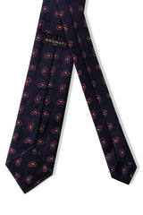 Backside of navy burgundy paisley silk jacquard tie in threefold construction.