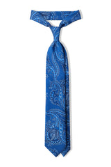 Blue paisley silk tie tied in a classic knot.