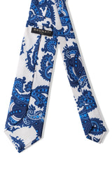Self-tipped backside of paisley printed silk tie in light blue and navy.