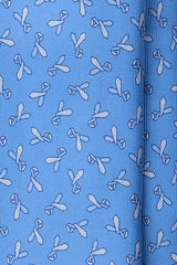 Close-up of patterned design on light blue Italian printed silk tie.