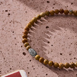 Natural Picture Jasper elastic bracelet with engraved sterling silver centre element styled in a Brunati Como setting