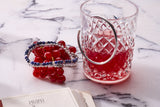 Brunati Como rounded bangle styled in an elegant red and silver still life