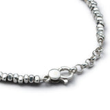 Detail of handmade 925 sterling silver Pebble Bracelet with smooth organic silver elements
