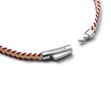 Detail of red and off-white stitched Italian textile bracelet with BRUNATI 925 Italian sterling silver clasp