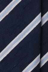 Close-up of navy, light blue and white striped silk shantung fabric texture.