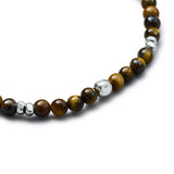 Detail of natural Tiger Eye elastic bracelet with smooth 925 sterling silver pebble elements and BC centre cube
