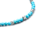 Detail of natural Turquoise elastic bracelet with smooth 925 sterling silver pebble elements and BC centre cube