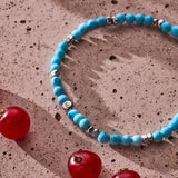 Natural Turquoise elastic bracelet with sterling silver pebble elements styled in a Brunati Como setting