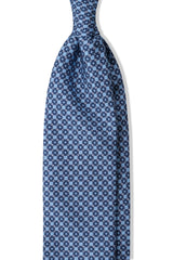 Light blue, navy and pink butterfly chains printed silk tie, shown from the front.