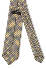 Back view of the vanilla, light blue and white butterfly chains printed silk tie.