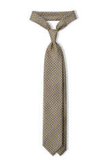 Vanilla, light blue and white butterfly chains printed silk tie, tied in a clean knot.