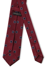 Back view of the bordeaux and navy geometric square silk jacquard tie.
