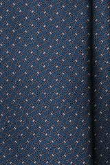 Close-up of the petrol printed silk fabric with a horsebit pattern.