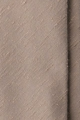 Close-up of the textured ivory beige silk shantung fabric.