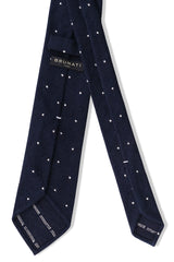 Back view of the navy and white polka dot grenadine shantung silk tie with hand-rolled edges.