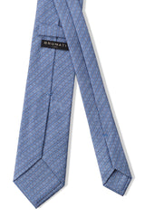 Back view of the light blue, navy and white stirrup chain printed silk tie.