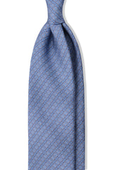 Light blue, navy and white stirrup chain printed silk tie, shown from the front.