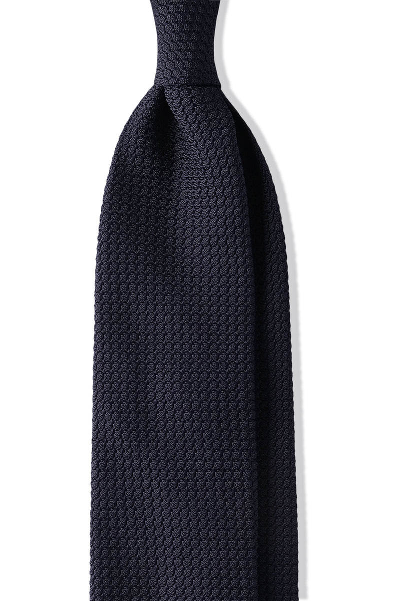 Close-up of the 3-Fold Plain Silk Grenadine Garza Grossa tie in navy with handrolled edges, handmade in Italy