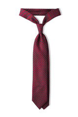Red, light blue and white butterfly chains printed silk tie, tied in a clean knot.