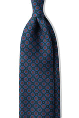 Forest, blue and orange floral Ancient Madder silk tie, shown from the front.