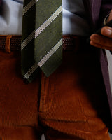 Model wearing the green and white grenadine shantung silk tie in a tailored look.