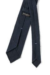 Back view of the navy plain grenadine shantung silk tie with hand-rolled edges.