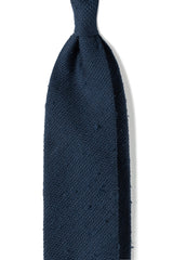 Navy plain grenadine shantung silk tie, shown from the front.