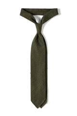 Olive plain grenadine shantung silk tie, tied in a knot.