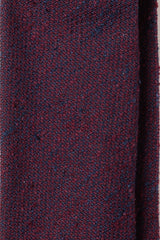 Close-up of the textured purple grenadine shantung silk fabric.