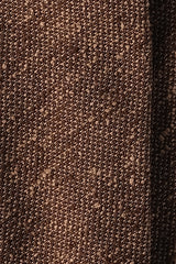 Close-up of the textured mustard silk shantung fabric.